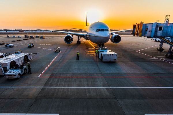 Image of airplane on tarmac by Ken Yam on Unsplash